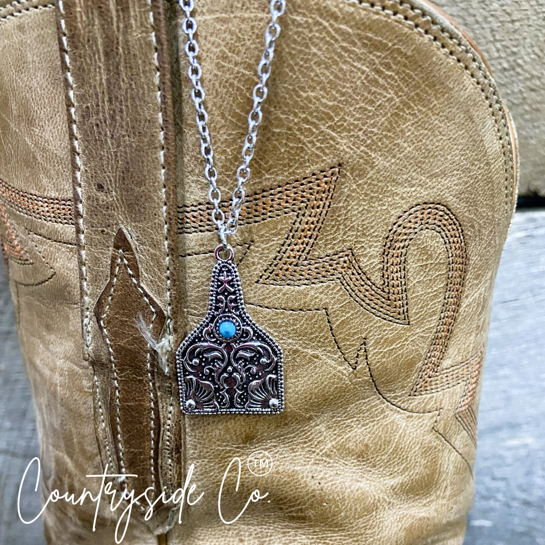 Tooled Silver & Turquoise Accent Cowtag Necklace